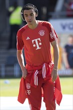 Jamal MUSIALA FC Bayern Munich with headphones in front of the game