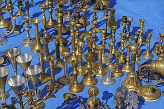 Antique brass and bronze candleholders for sale at flea market