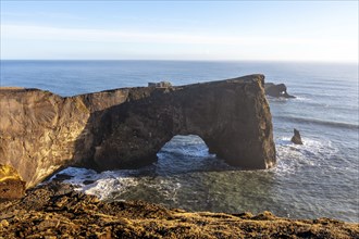 Famous arch on Dyrholaey beach in Iceland in the cold winter, near Vik