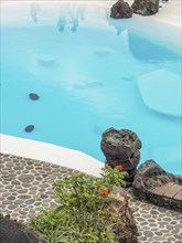 Blue pool with rocks and paved stone path, lanzarote, Canary Islands, Spain, Europe