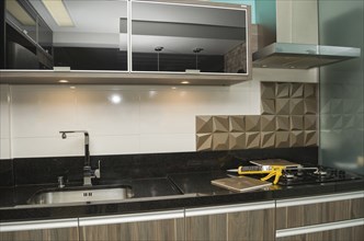 Renovating the kitchen, installing tile on the wall