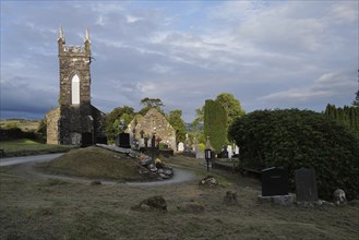 Church and graveyard in Cúil Aodha in West Cork on a sunny evening. County Cork, Ireland, Europe