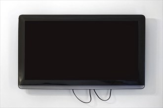 Black lcd TV set at wall