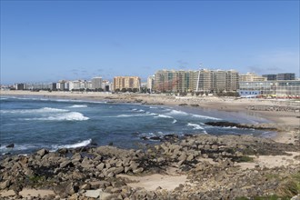 City view with sandy beach and surf in the Atlantic Ocean, She Changes landmark, Rotunda da