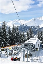 Oetz, Tyrol, Austria. February 2016. Cable car brings winter sports enthusiasts to the slopes in