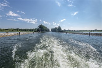 Drive shaft of a boat entering a lake at the river exit