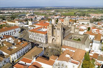 Evora drone aerial view on a sunny day with historic buildings city center and church in Alentejo,