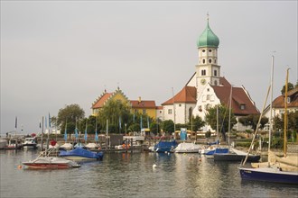 View of the harbour and the peninsula of moated castle on Lake Constance