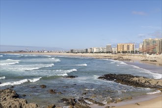 City view with sandy beach and surf in the Atlantic Ocean, She Changes landmark, Rotunda da