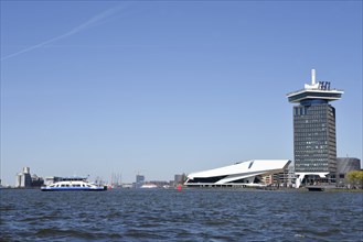 Amsterdam, Netherlands. April 2023. The river IJ with the Eye museum and a canalboat