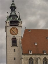 Detailed view of a Gothic clock tower of a church under a gloomy sky, Dürnstein, Wachau, Danube,