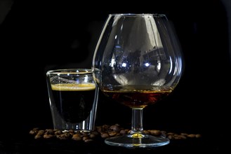 Den Helder, the Netherlands. January 2022. Close up of coffee with cognac on black background.