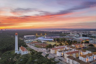 Aerial drone view of Vila Real de Santo Antonio city, lighthouse farol and stadium in Portugal, at