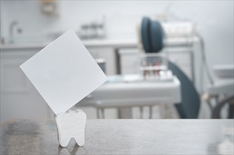 Blank card with dental office in the background