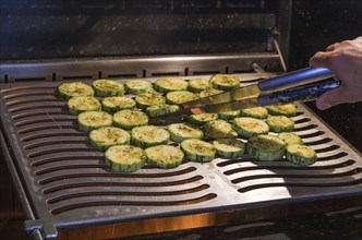 Delicious zucchini bbq, sliced ??zucchini on top of grill, close up photo