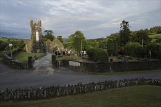 A view of the Church and graveyard near St Gobnait's well in Cúil Aodha in West Cork on a sunny