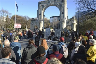 CHRISTCHURCH, NEW ZEALAND, JULY 24, 2021, People gather at a protest rally at the Bridge of