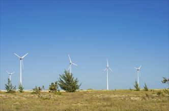 Great concept of renewable, sustainable energy. Wind field with wind turbines, producing aeolian