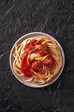 Meatballs. Beef meat balls, shot from above with spaghetti pasta, parsley, and tomato sauce, on a