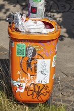 Overfilled public litter bin or rubbish bin, Germany, Europe