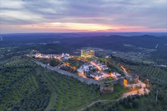 Evoramonte drone aerial view of village and castle at sunset in Alentejo, Portugal, Europe