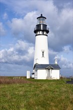 A partly sunny day at Yaquina Bay Lighthouse in Newport, Oregon