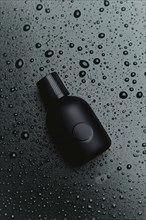 Close-up of a black bottle lying amidst water droplets with a textured dark background, AI