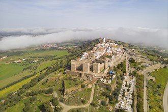 Monsaraz drone aerial view on the clouds in Alentejo, Portugal, Europe