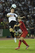 Football match, Niklas KÖLLE SSV Ulm left, heads the ball in the air, Joshua KIMMICH FC Bayern