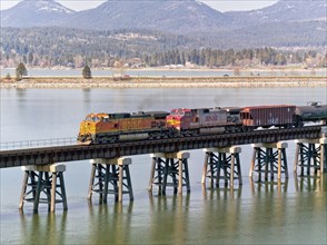 A train travels across the bridge that spans Lake Pend Oreille by Sandpoint, Idaho