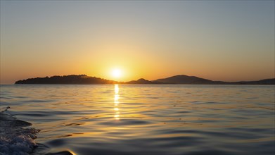 Evening sun over the sea, in front of sunset, island world off Vodice, Dalmatia, Croatia, Europe