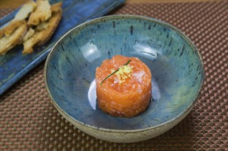 Salmon tartare deliciousness in a beautiful decorated plate