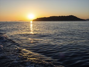 Evening sun over the sea, in front of sunset, island world off Vodice, Dalmatia, Croatia, Europe