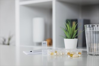 Closeup of medical pill box with doses of tablets for daily take a medicine for treatment, cure the