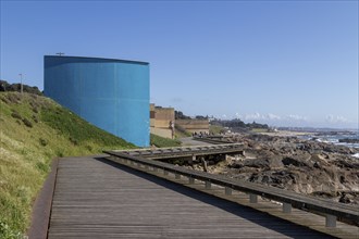 Passadiço das Ondas boardwalk, rocks and surf on the beach promenade in Nevogilde, Norte region,