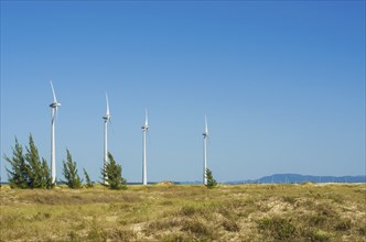 Great concept of renewable, sustainable energy. Wind field with wind turbines, producing aeolian