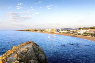 Blanes city and beach from Sa Palomera rock at morning in Spain