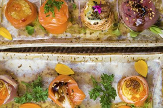 Platter decorated with different flavors of elegant sushi. Selective focus