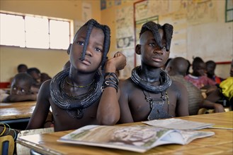 Girls, Himba pupils, sitting in a classroom at the Omohanga Primary School, Himba school, Omohanga,