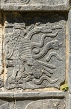 Carved stonework figure, Platform of Skulls, Tzompantli, Chichen Itzá, Mayan ruins, Yucatan,