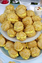 Swabian cuisine, mini cream puffs filled with goat's cream cheese, cream cheese éclairs,