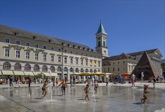 Children playing at the water games on the market place, Karlsruhe, Baden-Württemberg, Germany,