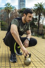 A man resting after exercising outdoors. Concept: sport. Athlete man outdoors