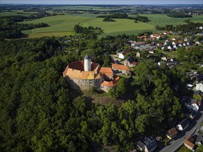 Schönfels Castle with the newly renovated keep (castle tower) . Schönfels Castle is a typical