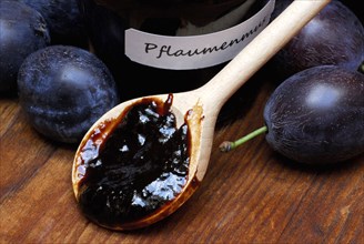 Plum jam in jar and plums, plum, plum plum, plum plum, plum, spoon, wooden spoon