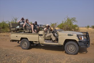 Tourists in a safari vehicle, Nsefu Sector, South Luangwa National Park, Zambia, Africa