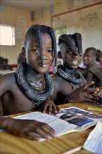 Girls, Himba pupils, sitting in a classroom at the Omohanga Primary School, Himba school, Omohanga,