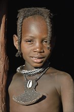 Himba girl at the door of her hut, portrait, Omohanja, Kaokoland, Kunene, Namibia, Africa