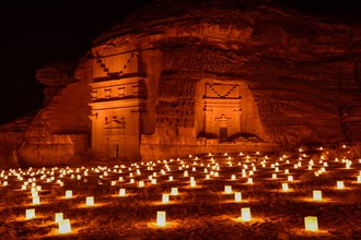 Illuminated Nabataean tombs at night, Hegra or Mada'in Salih, AlUla region, Medina province, Saudi