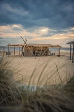 Stand hut with lamps at sunset, Zandvoort, Netherlands